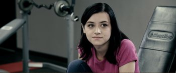 Movie still from “Hostage 911” (2018), directed by Robert Rodriguez – A woman sitting in front of a mirror in a room; Close Up shot, Over the shoulder angle