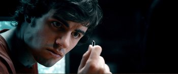 Movie still from “Hostage 911” (2018), directed by Robert Rodriguez – A person holding a cell phone; Extreme Close Up shot, High angle