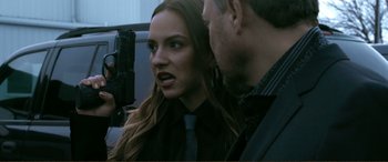 Movie still from “Hostage 911” (2018), directed by Robert Rodriguez – A man and a woman are talking to each other; Close Up shot, Over the shoulder angle