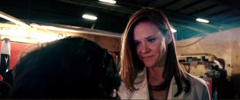 Movie still from “Hostage 911” (2018), directed by Robert Rodriguez – A person sitting in front of another person; Close Up shot, Over the shoulder angle