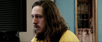 Movie still from “Hostage 911” (2018), directed by Robert Rodriguez – A person with long brown hair; Close Up shot, Over the shoulder angle