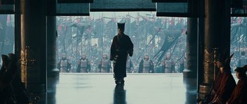 Movie still from “Red Cliff” (2008), directed by John Woo – A group of people standing in front of a wall; Wide shot, Low angle