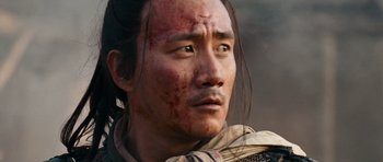 Movie still from “Red Cliff” (2008), directed by John Woo – A person with a face covered in blood; Close Up shot, Low angle