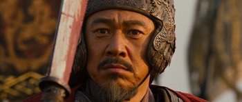 Movie still from “Red Cliff” (2008), directed by John Woo – A person wearing a helmet; Close Up shot, Low angle