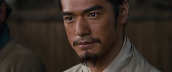 Movie still from “Red Cliff” (2008), directed by John Woo – A person with a beard; Close Up shot, Over the shoulder angle