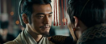 Movie still from “Red Cliff” (2008), directed by John Woo – A person with a beard; Close Up shot, Over the shoulder angle