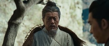 Movie still from “Red Cliff” (2008), directed by John Woo – An old man with a long beard and a long beard; Close Up shot, Low angle