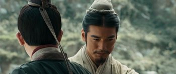 Movie still from “Red Cliff” (2008), directed by John Woo – A person wearing a hat; Close Up shot, Over the shoulder angle