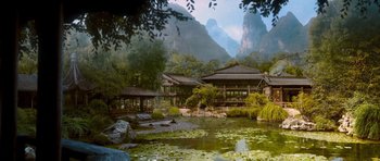 Movie still from “Red Cliff” (2008), directed by John Woo – A pond in the middle of a forest with mountains in the background; Extreme Wide shot, High angle