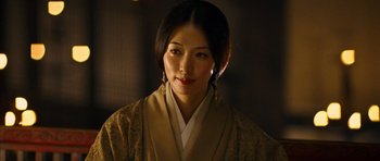 Movie still from “Red Cliff” (2008), directed by John Woo – A woman wearing a kimono is posing for a picture; Close Up shot, Over the shoulder angle