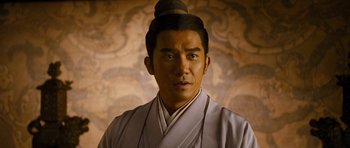 Movie still from “Red Cliff” (2008), directed by John Woo – A man in a white robe and a black hat; Close Up shot, Low angle