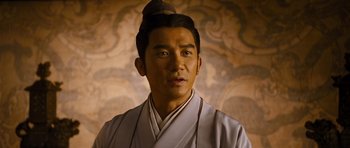 Movie still from “Red Cliff” (2008), directed by John Woo – A man in a white robe and a black hat; Close Up shot, Over the shoulder angle