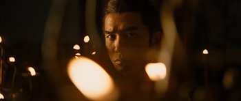 Movie still from “Red Cliff” (2008), directed by John Woo – A person looking at the camera; Close Up shot, Low angle