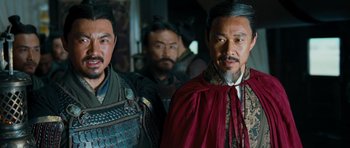 Movie still from “Red Cliff” (2008), directed by John Woo – A group of men standing next to each other in a room; Medium shot, Over the shoulder angle