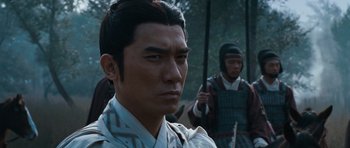 Movie still from “Red Cliff” (2008), directed by John Woo – A man in a samurai outfit with another man in the background; Close Up shot, Over the shoulder angle