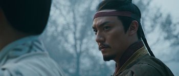Movie still from “Red Cliff” (2008), directed by John Woo – A person wearing a headband; Close Up shot, Low angle