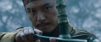 Movie still from “Red Cliff” (2008), directed by John Woo – A person holding a bow and arrow; Close Up shot, Low angle