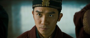 Movie still from “Red Cliff” (2008), directed by John Woo – A person wearing a hat; Close Up shot, Low angle