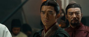 Movie still from “Red Cliff” (2008), directed by John Woo – A person wearing a costume; Close Up shot, Over the shoulder angle
