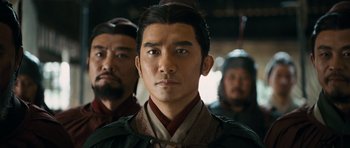 Movie still from “Red Cliff” (2008), directed by John Woo – A group of men standing next to each other; Close Up shot, Over the shoulder angle