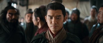 Movie still from “Red Cliff” (2008), directed by John Woo – A person wearing a hat; Close Up shot, Over the shoulder angle