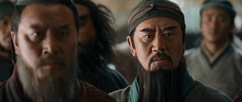 Movie still from “Red Cliff” (2008), directed by John Woo – A man with long black hair and a long beard; Close Up shot, Over the shoulder angle