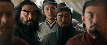Movie still from “Red Cliff” (2008), directed by John Woo – A group of men standing next to each other; Close Up shot, Over the shoulder angle