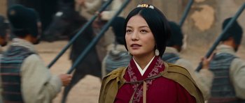 Movie still from “Red Cliff” (2008), directed by John Woo – A woman in a red and brown dress with a gold head piece; Close Up shot, Over the shoulder angle