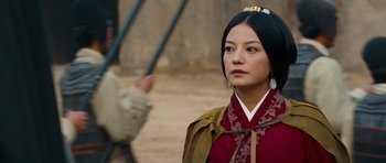 Movie still from “Red Cliff” (2008), directed by John Woo – A woman in a red dress is standing in front of a man; Close Up shot, Over the shoulder angle