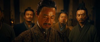 Movie still from “Red Cliff” (2008), directed by John Woo – A group of men standing next to each other in a room; Close Up shot, Over the shoulder angle