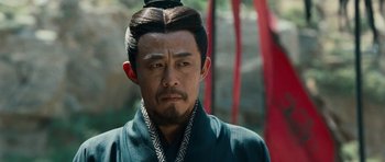 Movie still from “Red Cliff” (2008), directed by John Woo – A man in a black robe and a black hat; Close Up shot, Low angle