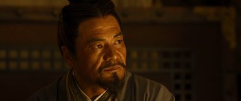 Movie still from “Red Cliff” (2008), directed by John Woo – A person with a beard; Close Up shot, Over the shoulder angle