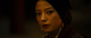 Movie still from “Red Cliff” (2008), directed by John Woo – A person wearing a jacket; Close Up shot, High angle