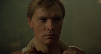 Movie still from “Red Heat” (1988), directed by Walter Hill – A person with a nose ring; Close Up shot, Low angle