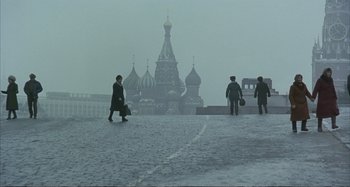 Movie still from “Red Heat” (1988), directed by Walter Hill – A group of people walking down a street in the fog; Extreme Wide shot, Low angle