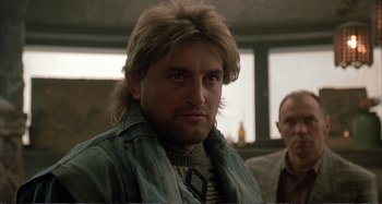 Movie still from “Red Heat” (1988), directed by Walter Hill – A person wearing a jacket; Close Up shot, Low angle