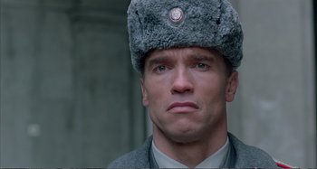 Movie still from “Red Heat” (1988), directed by Walter Hill – A person wearing a hat; Close Up shot, Low angle