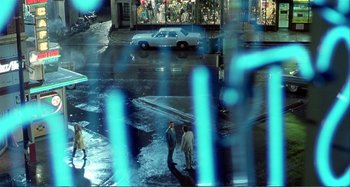 Movie still from “Red Heat” (1988), directed by Walter Hill – Two men standing on the side of the street; Extreme Wide shot, High angle