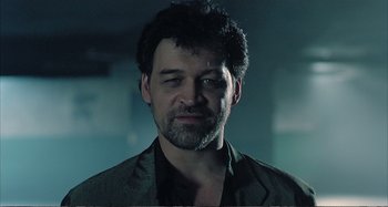 Movie still from “Red Heat” (1988), directed by Walter Hill – A person with a beard; Close Up shot, Low angle