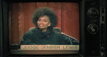 Movie still from “Red Heat” (1988), directed by Walter Hill – A person sitting in front of a microphone; Close Up shot, High angle