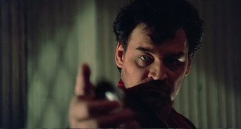 Movie still from “Red Heat” (1988), directed by Walter Hill – A person taking a picture with a cell phone; Close Up shot, Low angle