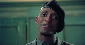 Movie still from “Red Heat” (1988), directed by Walter Hill – A person wearing a hat; Close Up shot, Low angle