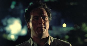 Movie still from “Red Heat” (1988), directed by Walter Hill – A person with blood on his face; Close Up shot, Low angle