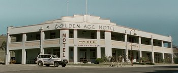 Movie still from “Red Hill” (2010), directed by Patrick Hughes – A couple of men walking in front of a motel; Extreme Wide shot, Low angle