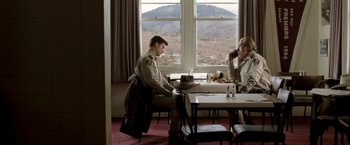 Movie still from “Red Hill” (2010), directed by Patrick Hughes – Two men sitting at a table in front of a window; Wide shot, Over the shoulder angle