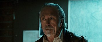 Movie still from “Red Hill” (2010), directed by Patrick Hughes – An older man with a gray beard stares at the camera; Close Up shot, Low angle