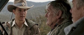 Movie still from “Red Hill” (2010), directed by Patrick Hughes – A man and a woman are standing in front of each other; Close Up shot, Over the shoulder angle