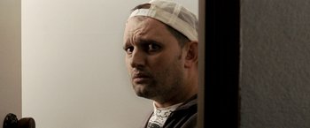Movie still from “Red Hill” (2010), directed by Patrick Hughes – A person with a bandage on his head; Close Up shot, Low angle