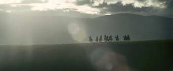 Movie still from “Red Hill” (2010), directed by Patrick Hughes – A group of people riding horses on top of a hill; Extreme Wide shot, Low angle
