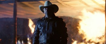 Movie still from “Red Hill” (2010), directed by Patrick Hughes – A man wearing a cowboy hat and a leather jacket; Medium shot, Low angle